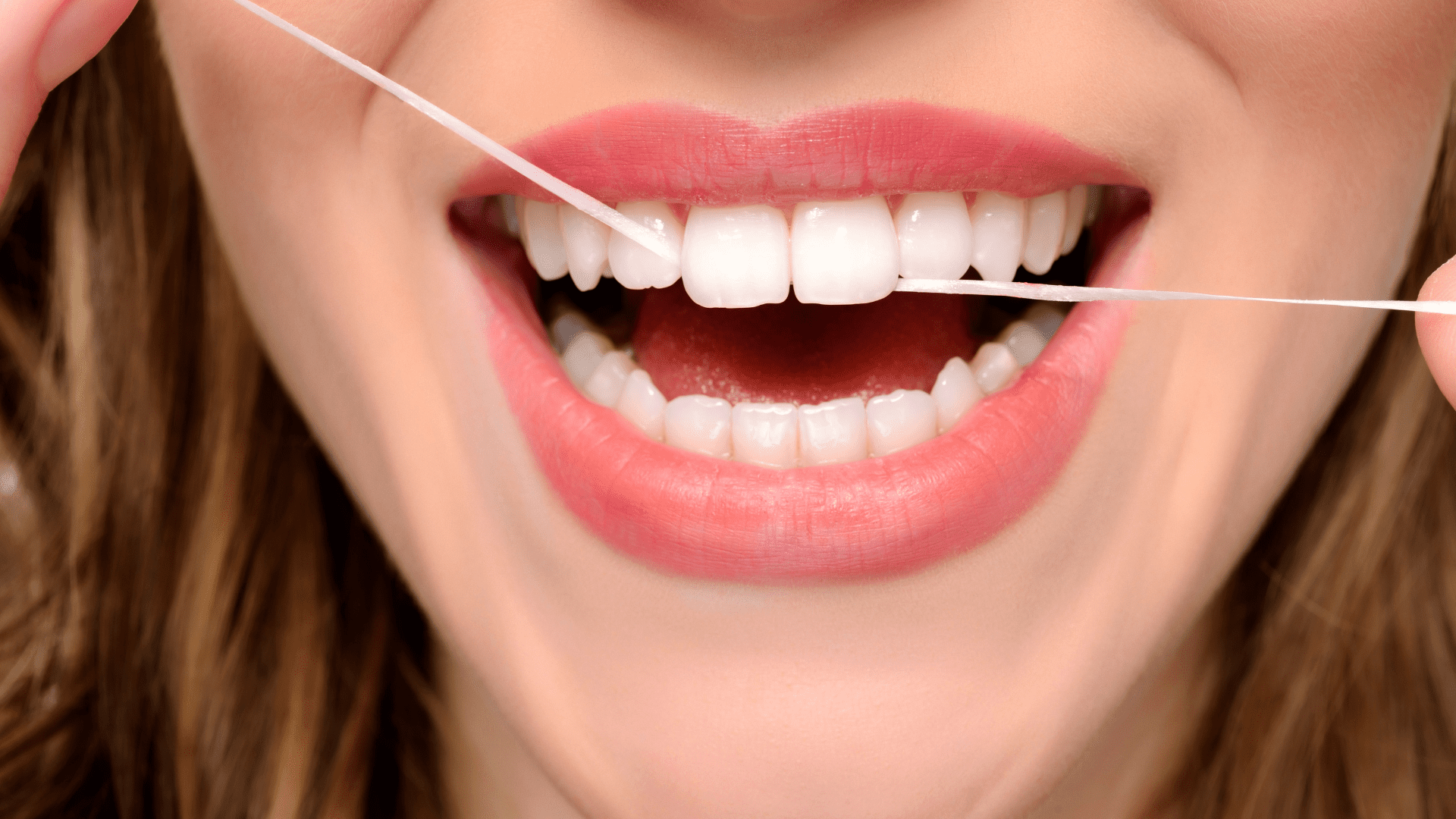 Flossing Teeth at Saraland Dentist - Teeth Cleaning